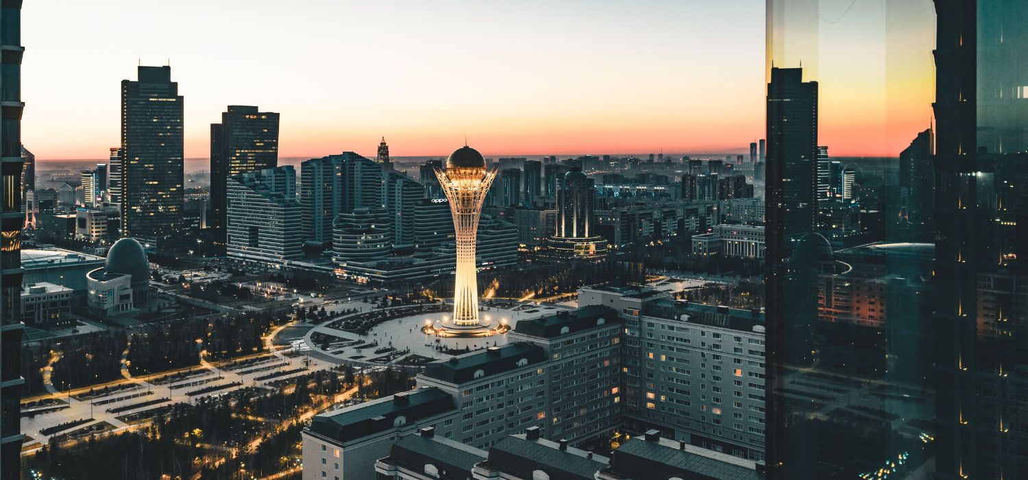 Night view towards Bayterek tower and hous of ministries in Astana Kazakhstan on a clear day