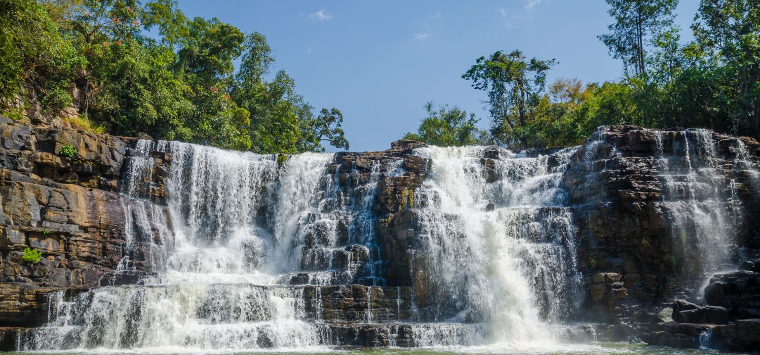 Beautiful Sala water falls near Labe with trees, green pool and a lot of water flow, Guinea Conakry, West Africa