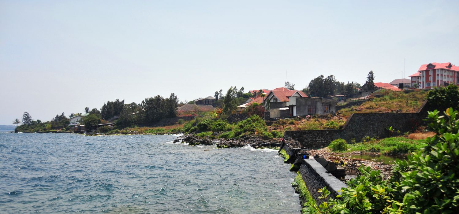 Goma, Nord-Kivu, Democratic Republic of the Congo: Lake Kivu shore with lava flows, vegetation and waterfront houses