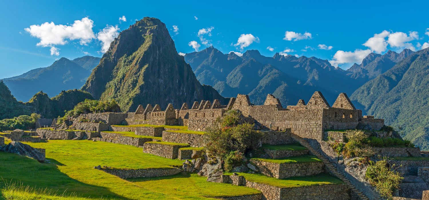 The main square of the Machu Picchu inca ruin with the Huayna Picchu peak in the background near Cusco, Peru.