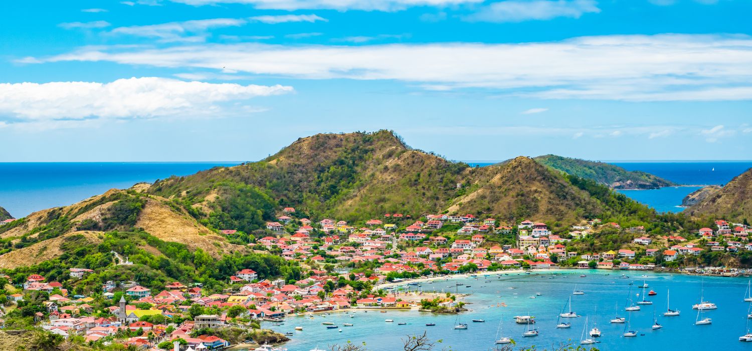 Terre-de-Haut, Les Saintes, Guadeloupe. Bright and colorful landscape with village, bay and mountains on a beautiful summer day