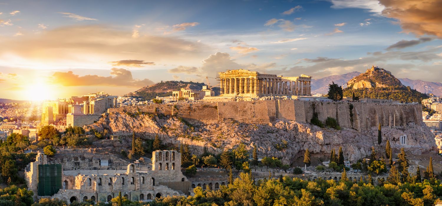 The Acropolis of Athens, Greece, with the Parthenon Temple on top of the hill during a summer sunset