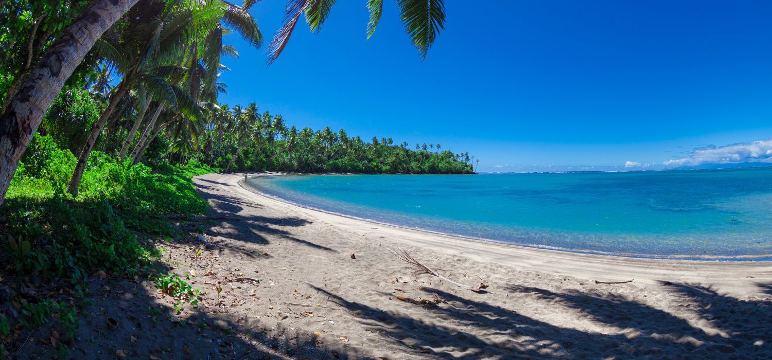 Tropical Samoa with white sandy beaches and coconut palms